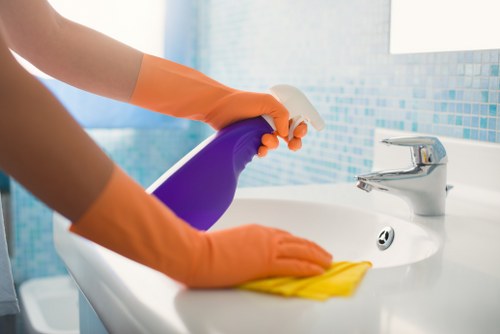 Deep cleaning a bathroom during move out cleaning