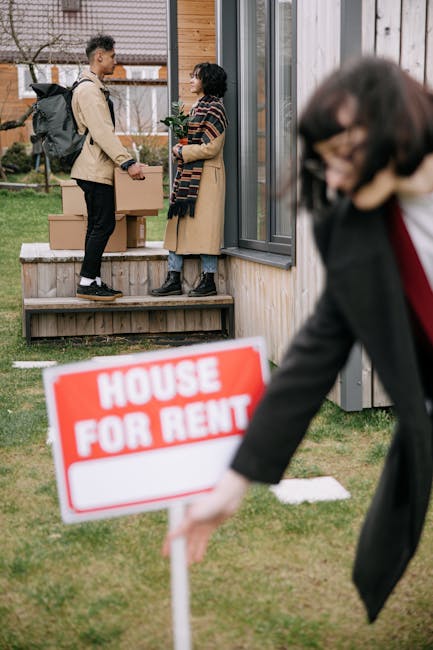 A scene outside a residential property featuring two individuals standing on a wooden porch engaged in conversation, with one holding a potted plant. The porch has a glass sliding door and wooden siding. In the foreground, a blurred woman in a dark blazer is placing a red and white 'House for Rent' sign into the ground. The setting is well-lit, with a grass lawn surrounding the porch. This image relates to property management or rental processes, emphasizing the importance of cleanliness and maintenance in rental properties, which Cleaners Maida Vale offers through their professional cleaning services for end of tenancy requirements near Maida Vale W9.
